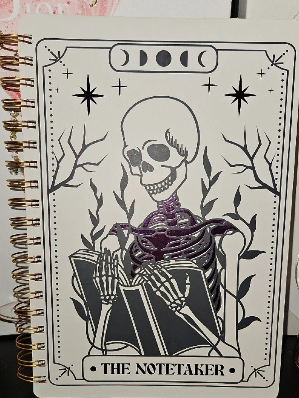 The Notetaker Spiral Notebook – White with Black & Purple Skeleton Design